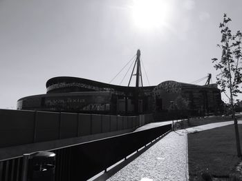 Low angle view of bridge in city against sky