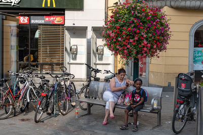 Full length of people on bicycle