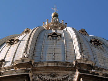 Low angle view of st peter basilica dome against clear sky