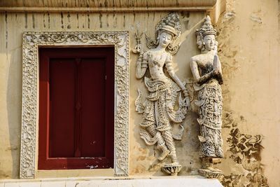 Statue in front of building