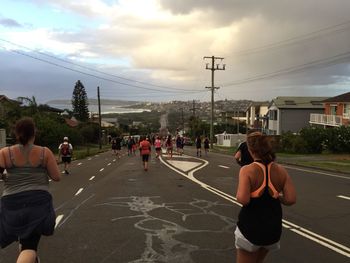 Group of people racing through residential district