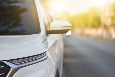 Close-up of car on road