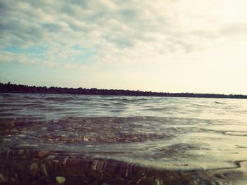 Scenic view of sea against cloudy sky