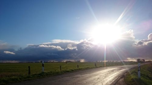 Scenic view of landscape against cloudy sky