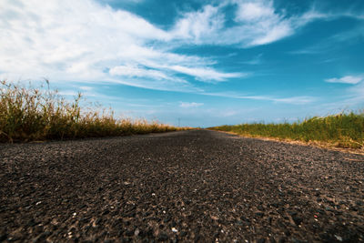 Surface level of road against sky