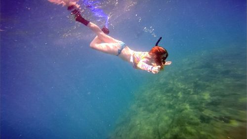 People swimming in water