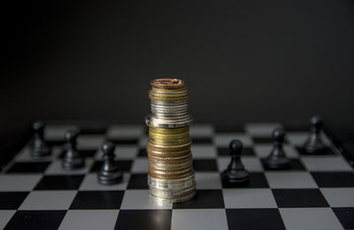 Close-up of coins on chess board