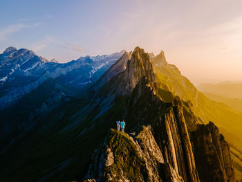 Panoramic view of mountain range against sky during sunset