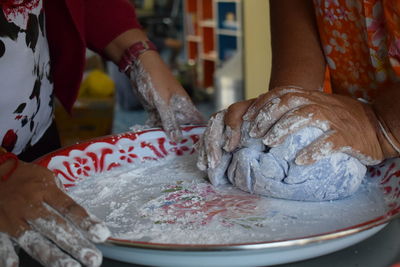 Close-up of hand holding ice cream