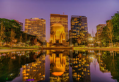 Reflection of illuminated buildings in water