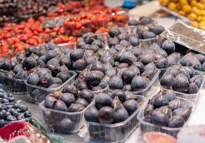 Side view with selective focus to fresh figs in the greengrocer's market