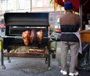 Man preparing food on barbecue grill