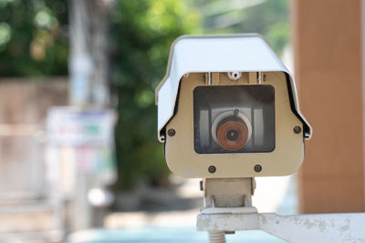Close-up of camera phone on wood