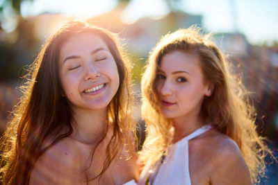 Close-up portrait of smiling young women