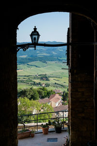 Scenic view of mountain seen through window