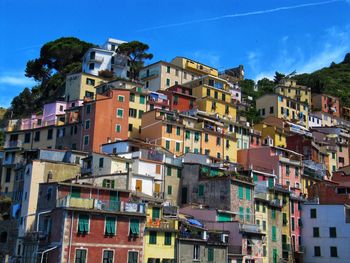 Low angle view of buildings against blue sky