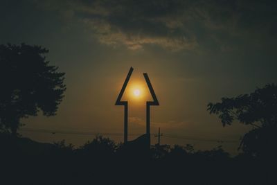 Low angle view of silhouette trees against sky during sunset