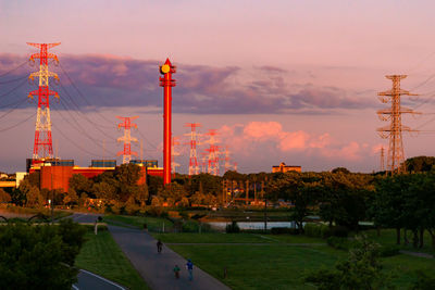 Buildings in city against sky during sunset