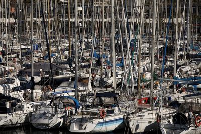 High angle view of sailboats moored at harbor