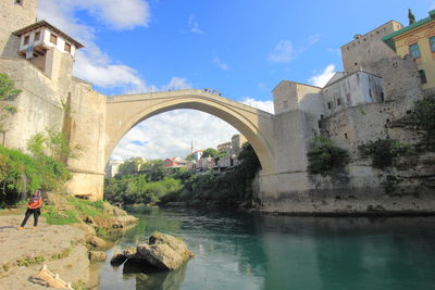 Arch bridge over canal in city