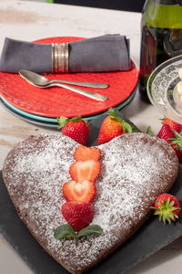 High angle view of strawberries in plate on table