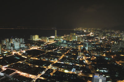 High angle view of illuminated buildings in city at night