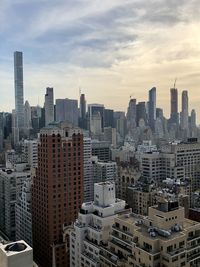 High angle view of buildings in city against sky