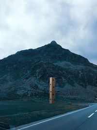 Road by mountain against sky on julierpass