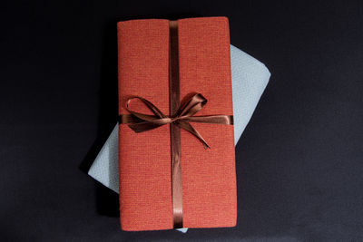 Close-up of red box over black background