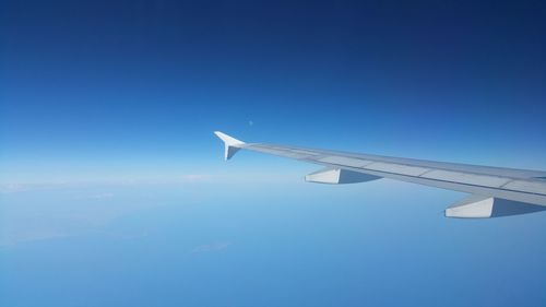 Low angle view of airplane flying in sky