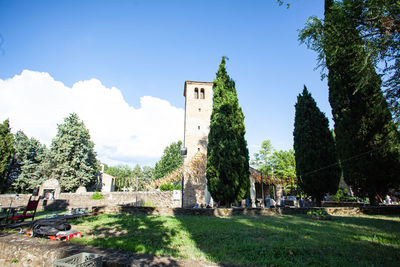 Panoramic view of trees and buildings against sky