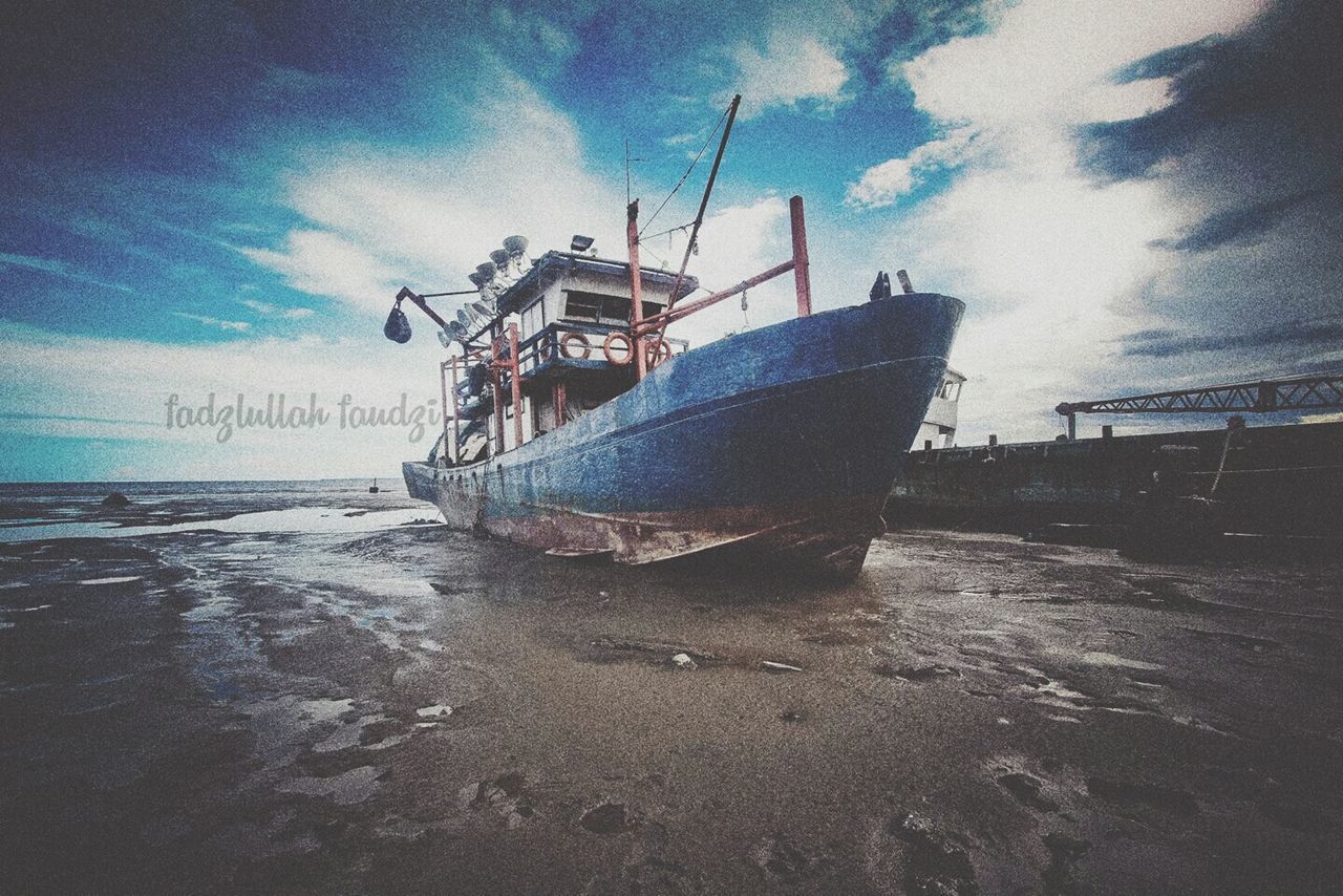 sea, sky, beach, water, nautical vessel, sand, shore, cloud - sky, horizon over water, transportation, boat, moored, mode of transport, cloud, nature, tranquility, cloudy, ship, tranquil scene, outdoors