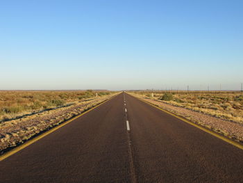 Empty road against sky