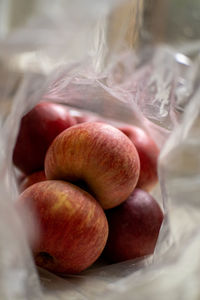 Close-up of apples in plastic