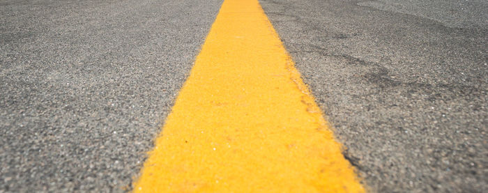 Surface level of yellow marking on road