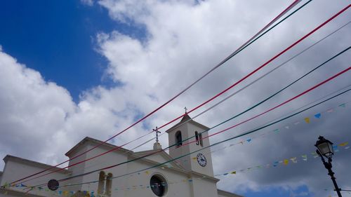 Low angle view of cables against sky