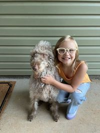 Portrait of boy playing with teddy bear