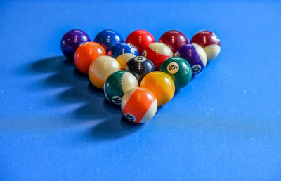 Close-up of pool balls arranged on table