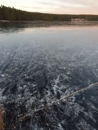 Scenic view of lake against sky during winter