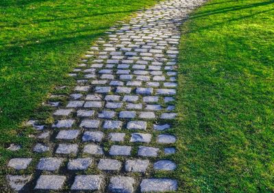 High angle view of stone wall on footpath