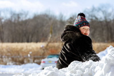 Portrait of girl playing in snow