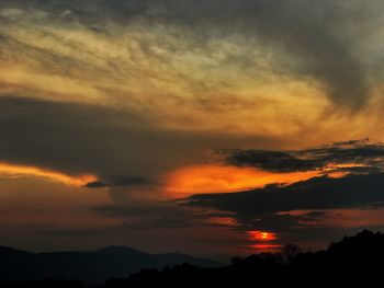 Scenic view of dramatic sky during sunset