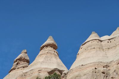 Low angle landscape of triangular rock formations in kasha-katuwe tent rocks national monument