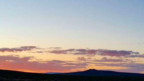 Scenic view of silhouette mountain against sky