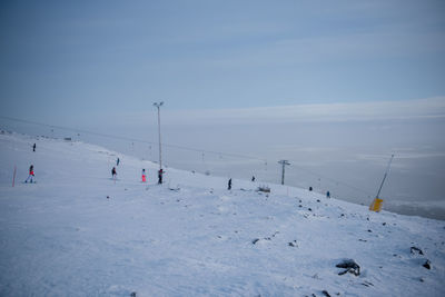 Scenic view of snow covered mountain against sky