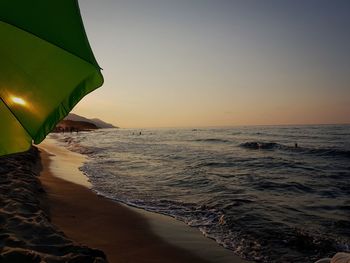 Scenic view of sea against clear sky during sunset