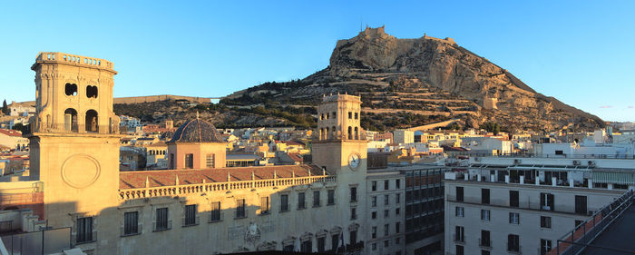 View of alicante, town hall building and santa barbara castle
