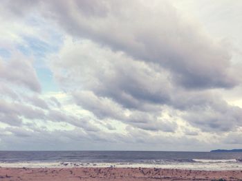 Scenic view of sea against cloudy sky