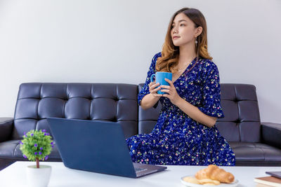 Young woman using mobile phone