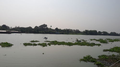 Scenic view of lake against clear sky